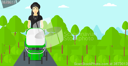 Image of Woman pushing pram.