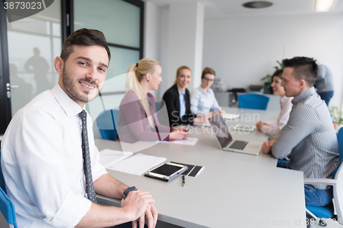 Image of young business people group on team meeting at modern office