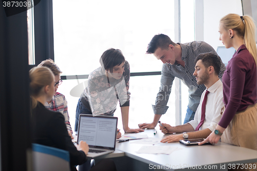 Image of young business people group on meeting at modern office