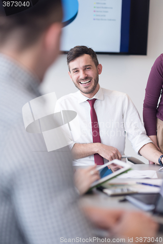 Image of young business people group on meeting at modern office