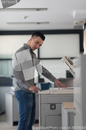 Image of young  business man copy documents