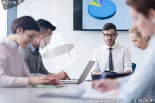 Image of young business people group on team meeting at modern office