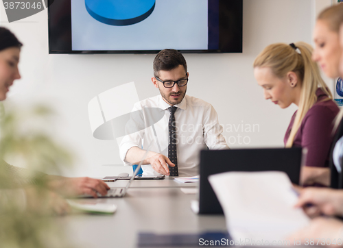 Image of young business people group on team meeting at modern office