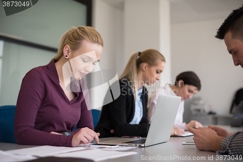 Image of young business people group on team meeting at modern office