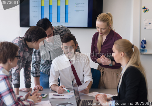 Image of young business people group on meeting at modern office