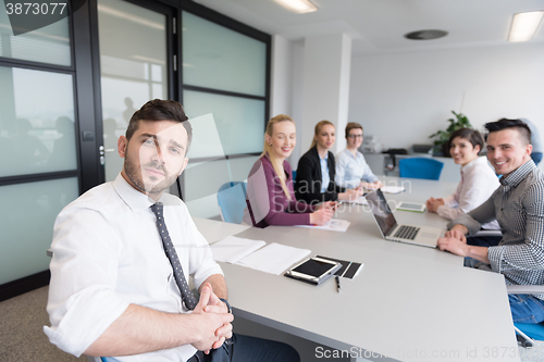 Image of young business people group on team meeting at modern office