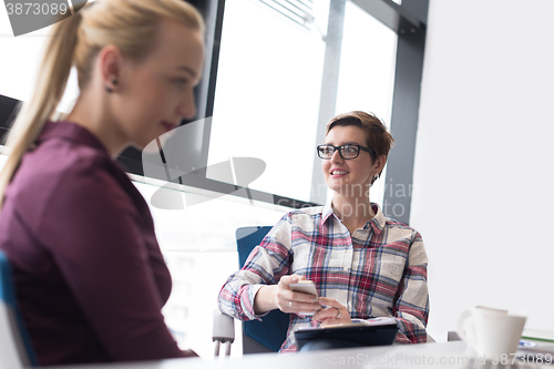 Image of young business woman at modern office meeting room