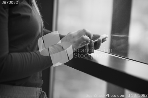 Image of business woman using smart phone at office