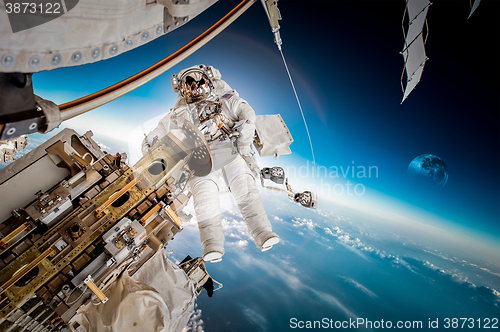 Image of International Space Station and astronaut.