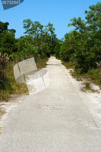 Image of long straight abandoned road