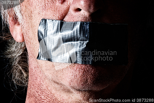 Image of duct taped mouth close up