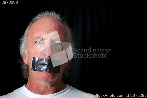 Image of wide eyed man with duct taped mouth