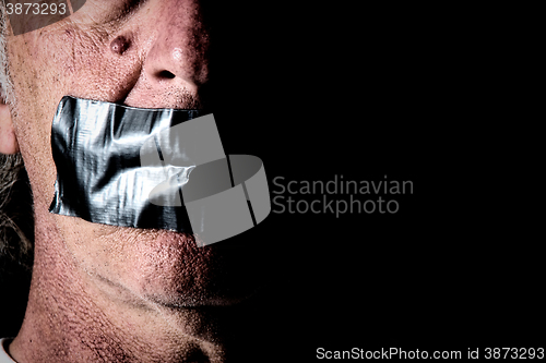 Image of duct tape over mouth of man