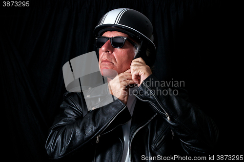 Image of biker in leather jacket sunglasses helmet