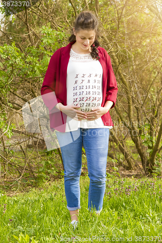 Image of Pregnant woman in red jacket 