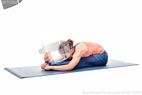 Image of Sporty woman practices Ashtanga Vinyasa yoga asana 