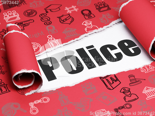 Image of Law concept: black text Police under the piece of  torn paper