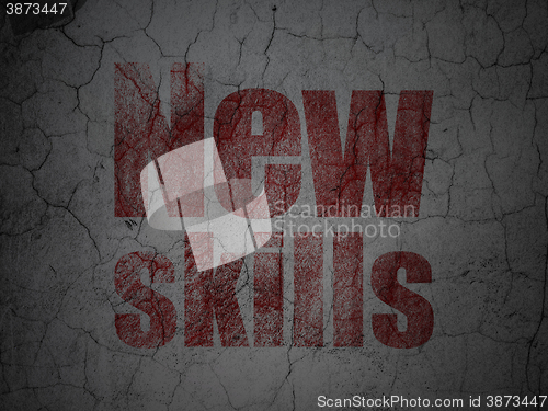 Image of Studying concept: New Skills on grunge wall background