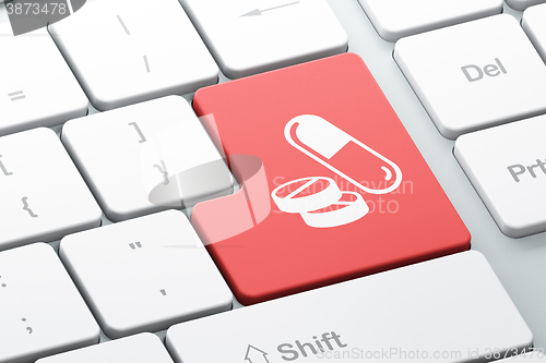 Image of Medicine concept: Pills on computer keyboard background