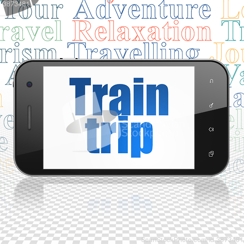 Image of Travel concept: Smartphone with Train Trip on display