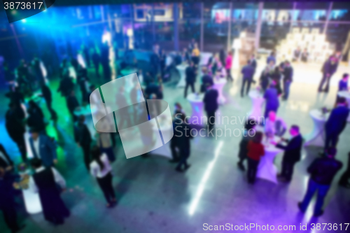 Image of Abstract blurred people in party