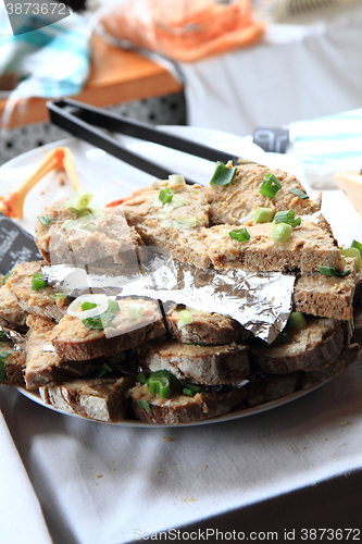 Image of cracklings spreading with bread
