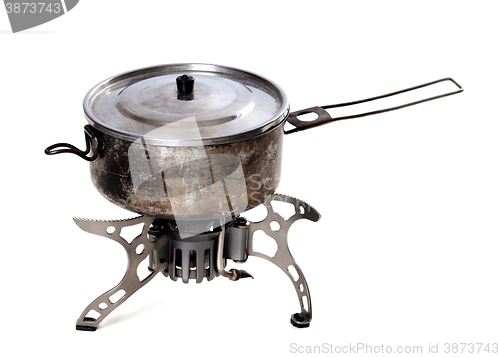 Image of Camping gas stove and old sooty hiking pan