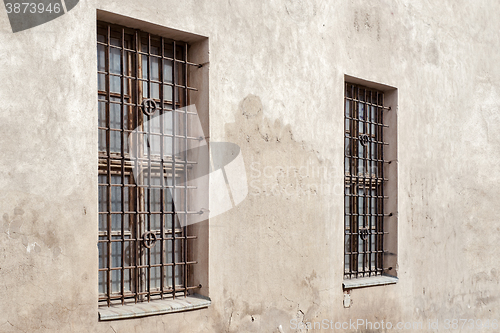 Image of abandoned cracked wall with two  window