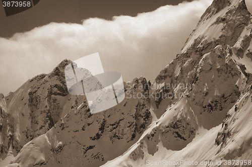 Image of Snowy mountains in clouds
