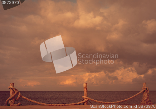 Image of Seafront and cloudy sky in autumn