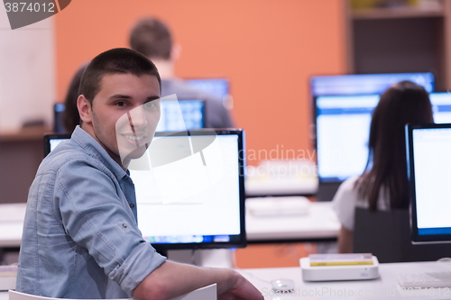 Image of technology students group in computer lab school  classroom