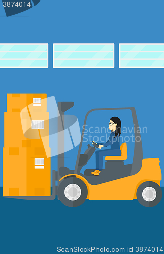 Image of Warehouse worker moving load by forklift truck.