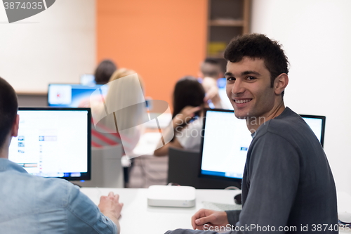 Image of technology students group working  in computer lab school  class