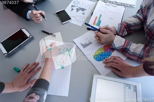 Image of top  view of business people group brainstorming on meeting
