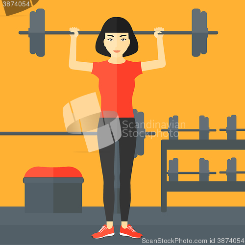 Image of Woman lifting barbell.