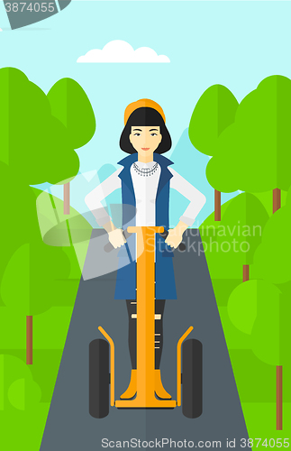 Image of Woman riding on electric scooter.
