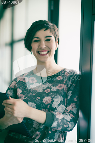 Image of portrait of business woman in casual clothes at startup office