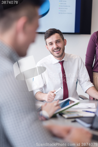 Image of young business people group on meeting at modern office