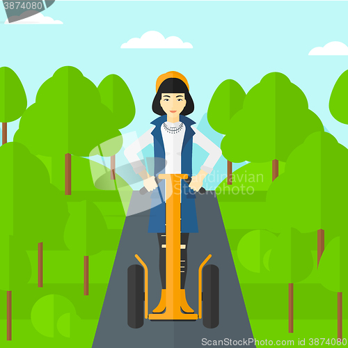 Image of Woman riding on electric scooter.