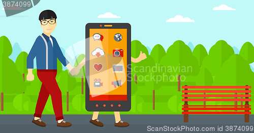 Image of Man walking with smartphone.