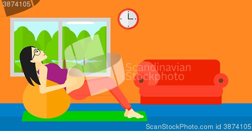 Image of Pregnant woman on gymnastic ball.