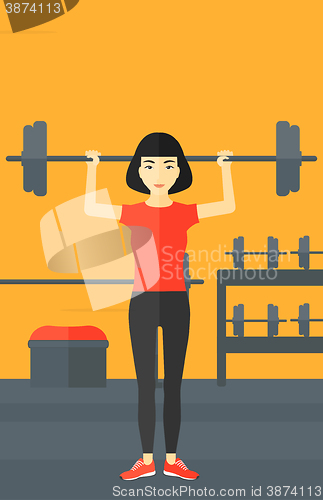 Image of Woman lifting barbell.