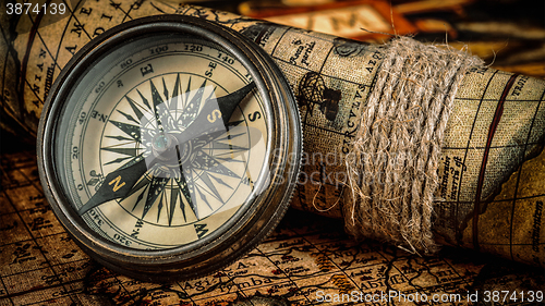 Image of Old vintage compass on ancient map