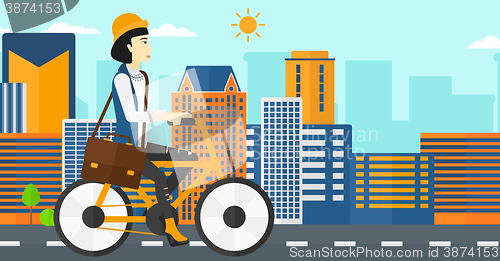 Image of Woman cycling to work.