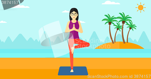 Image of Woman practicing yoga.