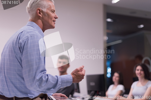 Image of teacher and students in computer lab classroom