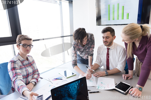 Image of young business people group on meeting at modern office