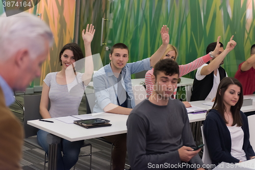 Image of students group raise hands up