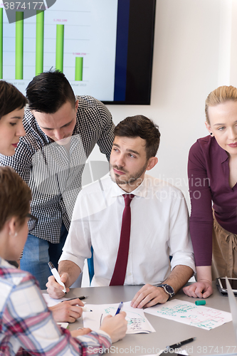 Image of young business people group on meeting at modern office