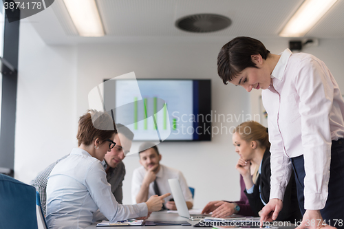 Image of young  woman using  tablet on business meeting